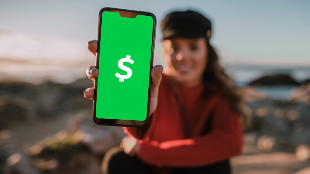 woman holding cash app