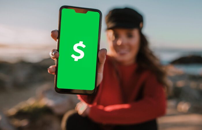 woman holding cash app
