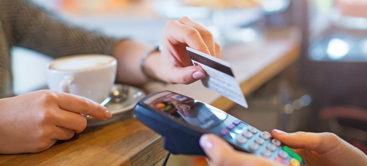 11customer paying for a coffee with a debit card