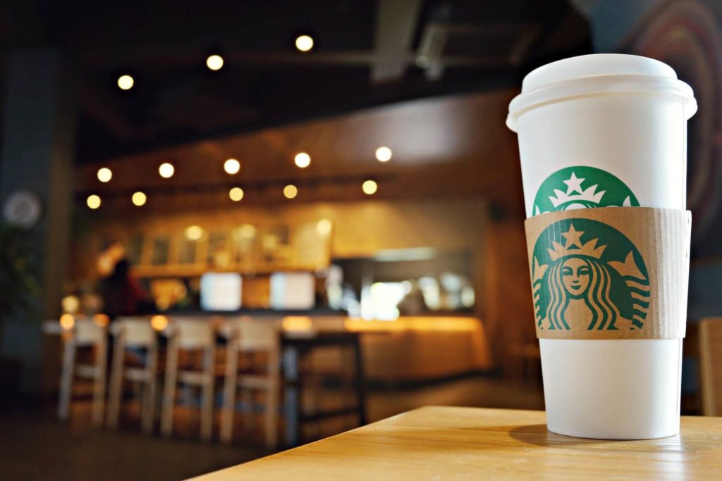 large Starbucks coffee on table