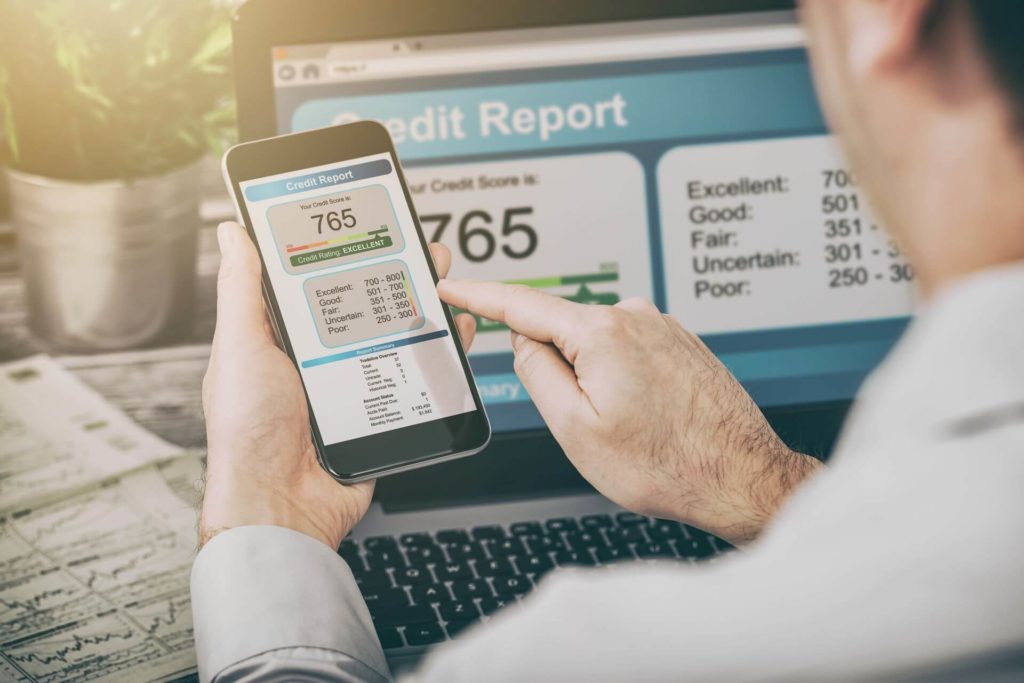 man checking his credit score online