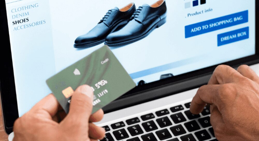 man buying shoes with debit card