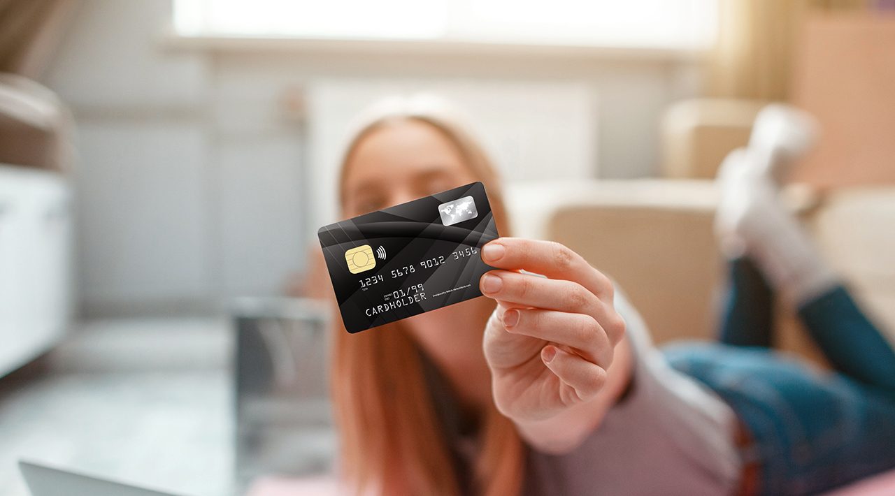 teenager holding debit card