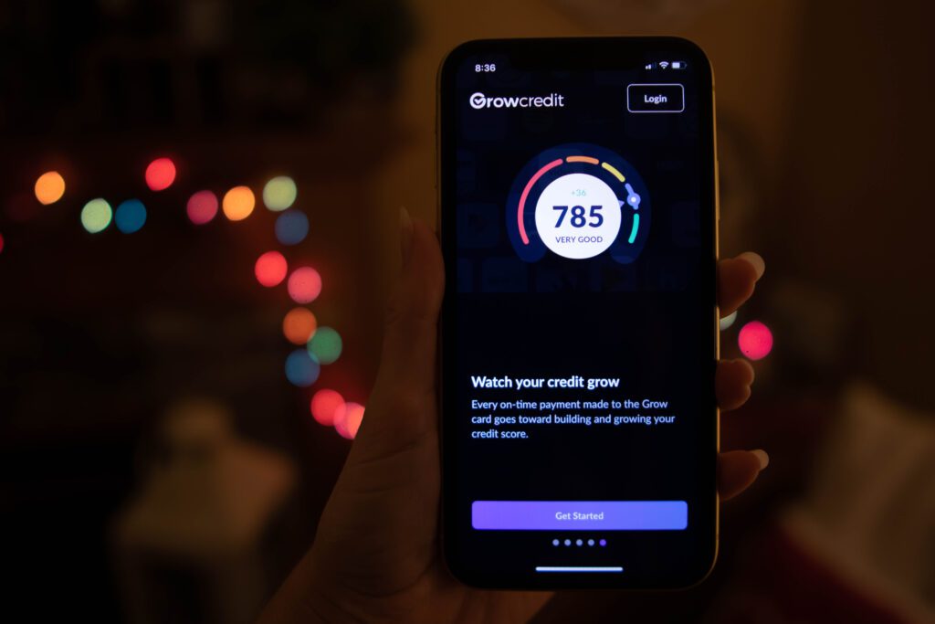 Grow Credit user reviews their credit score on a phone