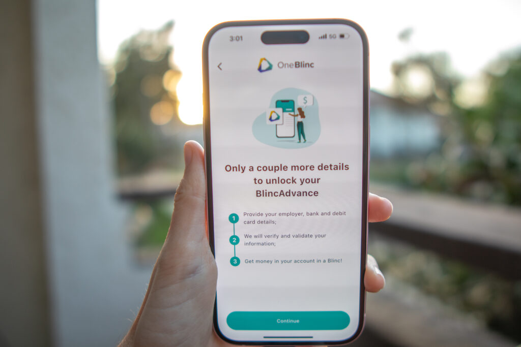 woman holding OneBlinc app