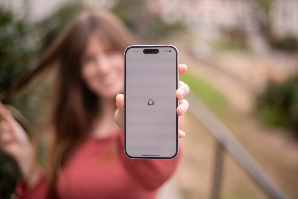 woman holding OneBlinc app
